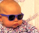 Traveling Baby wearing sunglasses