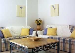 Blue and yellow lounge with fabric wall panels